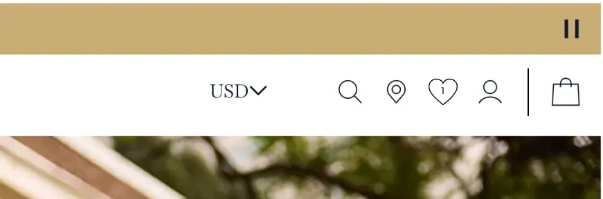 Store header icons with a wishlist heart showing a count of 1 beside the account and bag icons
